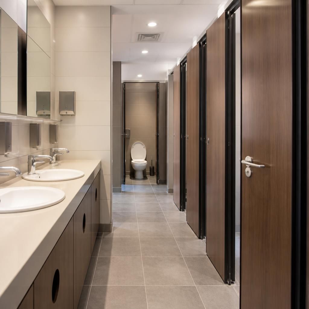 Commercial toilet facilities connected to a maintained drainage system